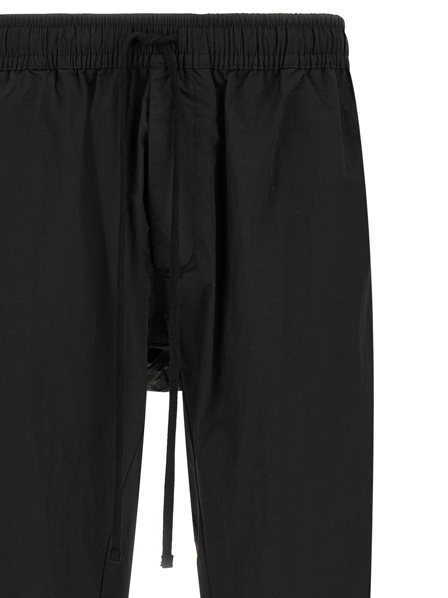 Trousers by Thom Krom for men in horse leather & polyamide black features a tailored silhouette with a tailored relaxed-fit, defined by its long and a sophisticated .