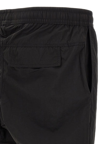 Trousers by Thom Krom for men in horse leather & polyamide black features an on trend silhouette, showcasing a sophisticated relaxed-fit with a long and for an on trend finish.