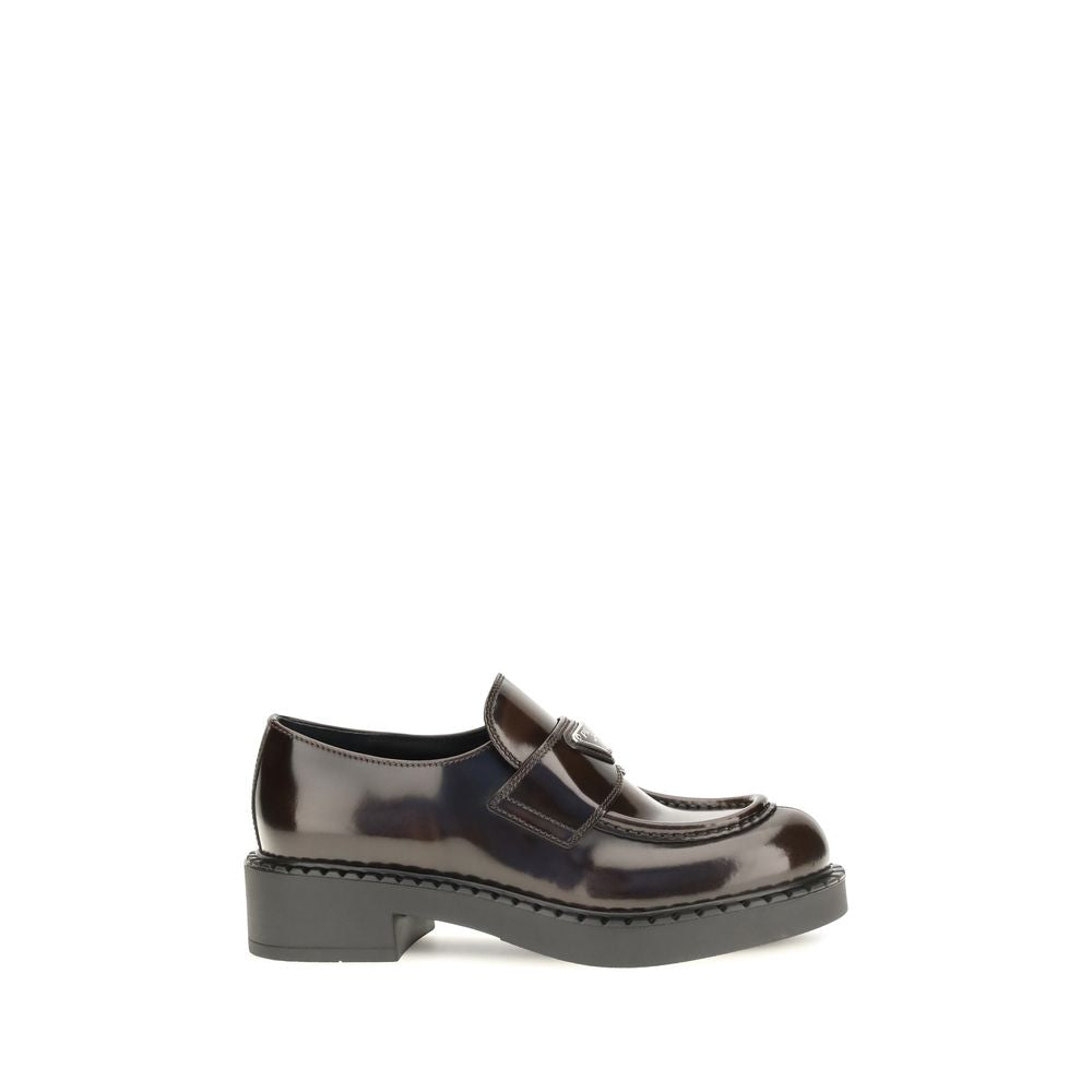 Flat Loafer Slip-On Shoes by Prada for women in bos taurus calf leather brown features an ergonomic silhouette, perfectly showcasing Women's Bos Taurus Calf Leather Flat Loafer Slip-On Shoes with its distinct flat and elegant .