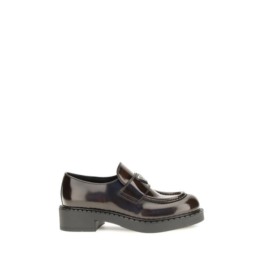 Flat Loafer Slip-On Shoes by Prada for women in bos taurus calf leather brown features an ergonomic silhouette, perfectly showcasing Women's Bos Taurus Calf Leather Flat Loafer Slip-On Shoes with its distinct flat and elegant .