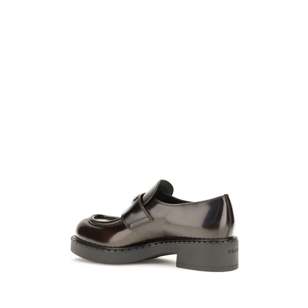 This Flat Loafer Slip-On Shoes by Prada for women in bos taurus calf leather brown features an exquisite silhouette from the Women's Bos Taurus Calf Leather Flat Loafer Slip-On Shoes collection, defined by a sophisticated flat and elegant .