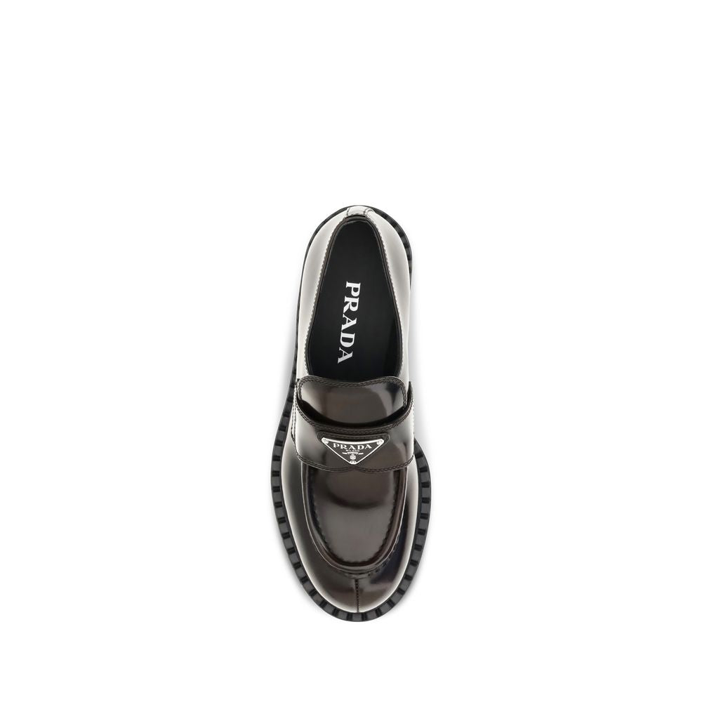 Flat Loafer Slip-On Shoes by Prada for women in bos taurus calf leather brown features an ergonomic silhouette, perfectly showcasing Women's Bos Taurus Calf Leather Flat Loafer Slip-On Shoes with its distinct flat and elegant .