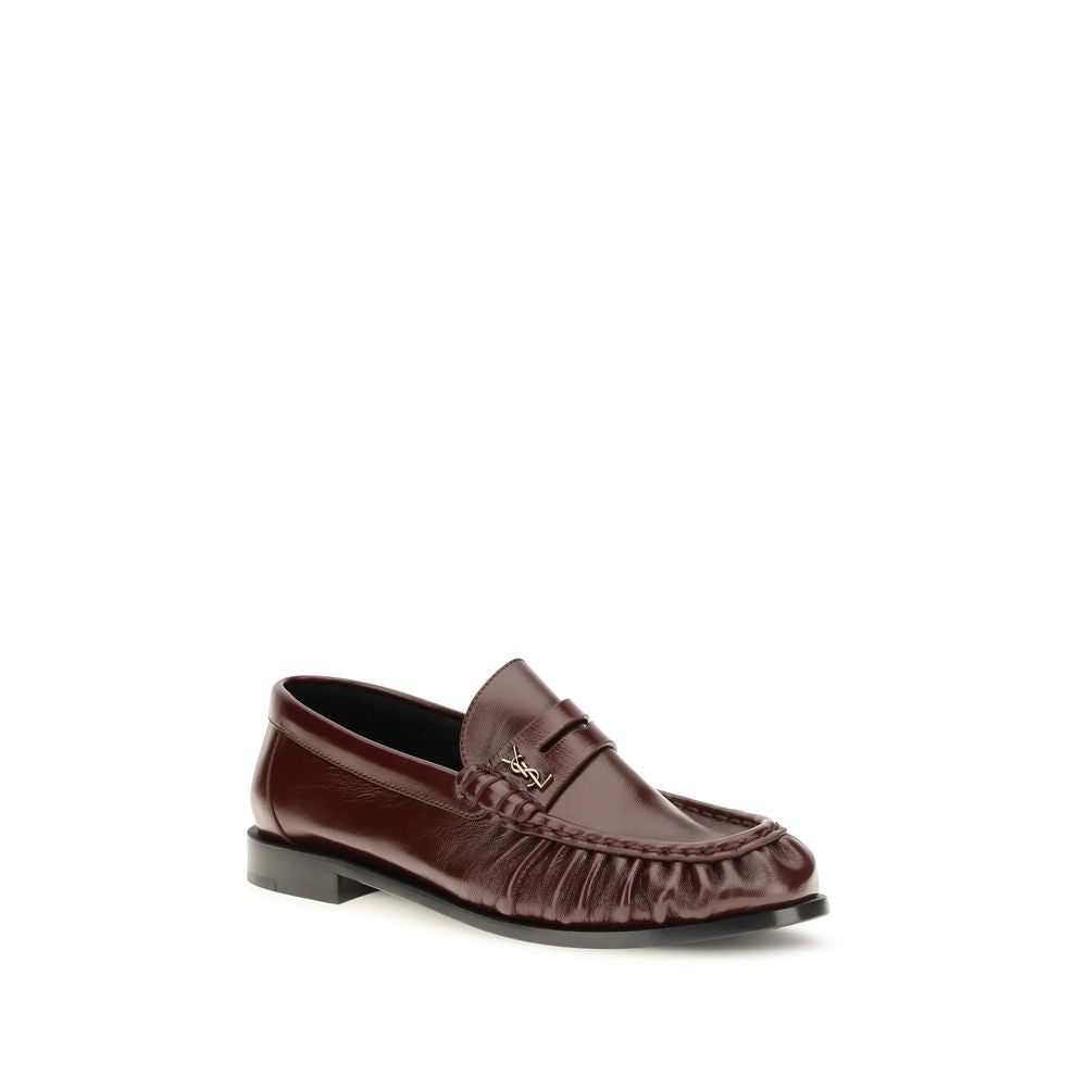Low-Heel Mid-Heel Loafer Slip-On Shoes by Saint Laurent for women in leather & metal bordeaux & gold showcases a resplendent Cassandre Women's Leather & Metal Low-Heel Mid-Heel Loafer Slip-On Shoes aesthetic, defined by its resplendent moc toe style and elegant 1-5-cm-heel low-heel 5-cm-heel mid-heel.