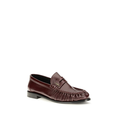 Low-Heel Mid-Heel Loafer Slip-On Shoes by Saint Laurent for women in leather & metal bordeaux & gold showcases a resplendent Cassandre Women's Leather & Metal Low-Heel Mid-Heel Loafer Slip-On Shoes aesthetic, defined by its resplendent moc toe style and elegant 1-5-cm-heel low-heel 5-cm-heel mid-heel.