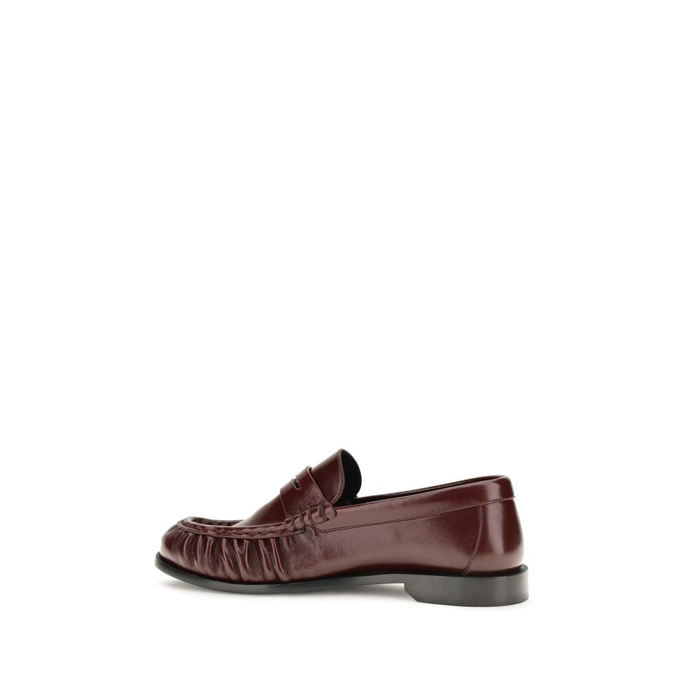 Low-Heel Mid-Heel Loafer Slip-On Shoes by Saint Laurent for women in leather & metal bordeaux & gold features an dynamic silhouette from the Cassandre Women's Leather & Metal Low-Heel Mid-Heel Loafer Slip-On Shoes collection, defined by a dynamic moc toe style and 1-5-cm-heel low-heel 5-cm-heel mid-heel for a dynamic look.