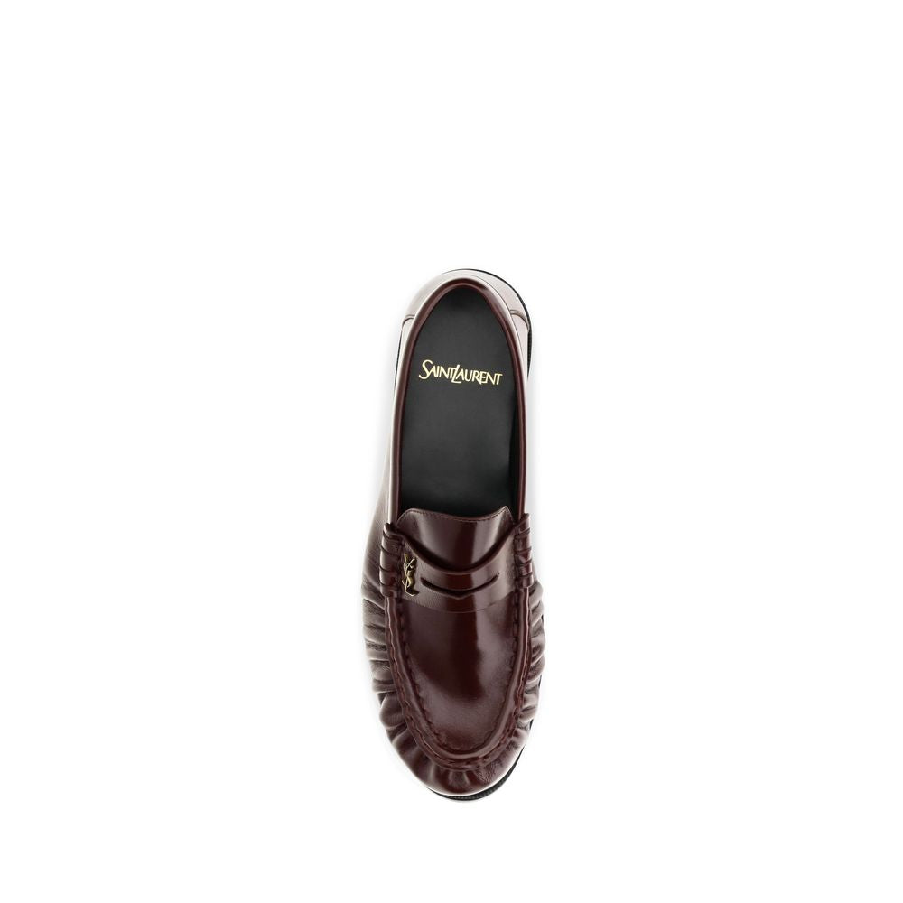Low-Heel Mid-Heel Loafer Slip-On Shoes by Saint Laurent for women in leather & metal bordeaux & gold features an effortless chic silhouette, showcasing the Cassandre Women's Leather & Metal Low-Heel Mid-Heel Loafer Slip-On Shoes design with an effortless chic 1-5-cm-heel low-heel 5-cm-heel mid-heel and a moc toe style for a effortless chic look.