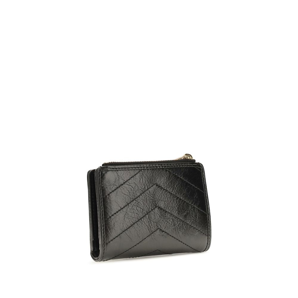 Cardholder Wallet by Saint Laurent for women in bos taurus calfskin leather black, bronze, chevron & signature showcases a enchanting silhouette, artfully detailed with the signature style of the Cassandre Niki Bos Taurus Calfskin Leather Cardholder Wallet and functional card-organization bifold.