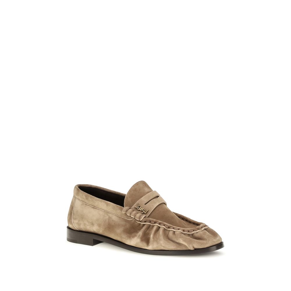 Low-Heel Mid-Heel Loafer Slip-On Shoes by Saint Laurent for women in bos taurus suede calf leather beige & gold features an effortless chic silhouette, showcasing the Cassandre Women's Bos Taurus Suede Calf Leather Low-Heel Mid-Heel Loafer Slip-On Shoes design with an effortless chic 1-5-cm-heel low-heel 5-cm-heel mid-heel and a moc toe style for a effortless chic look.