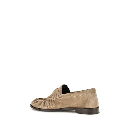 Low-Heel Mid-Heel Loafer Slip-On Shoes by Saint Laurent for women in bos taurus suede calf leather beige & gold features an ergonomic silhouette, perfectly showcasing Cassandre Women's Bos Taurus Suede Calf Leather Low-Heel Mid-Heel Loafer Slip-On Shoes with its distinct 1-5-cm-heel low-heel 5-cm-heel mid-heel and elegant moc toe style.