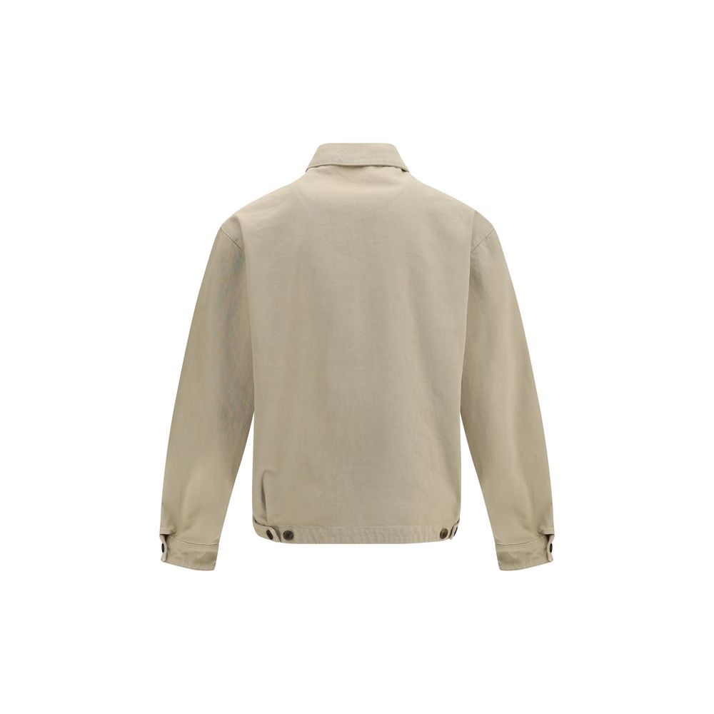This Trucker Jacket by Prada for men in denim cotton beige exhibits a edgy silhouette, meticulously detailed with functional pockets and a edgy for a edgy finish.