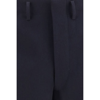 Trousers by Prada for men in wool blue presents a perennial silhouette, meticulously tailored with a regular-fit & wide cut, long finish, and an elegant high rise.