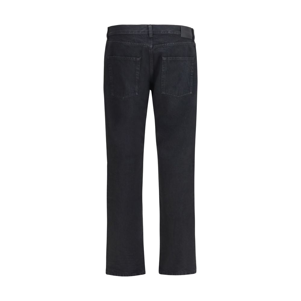 Jeans by Saint Laurent for men in denim cotton black presents a tailored silhouette, showcasing a tailored regular-fit & slim and long cut with a refined for a truly tailored aesthetic.