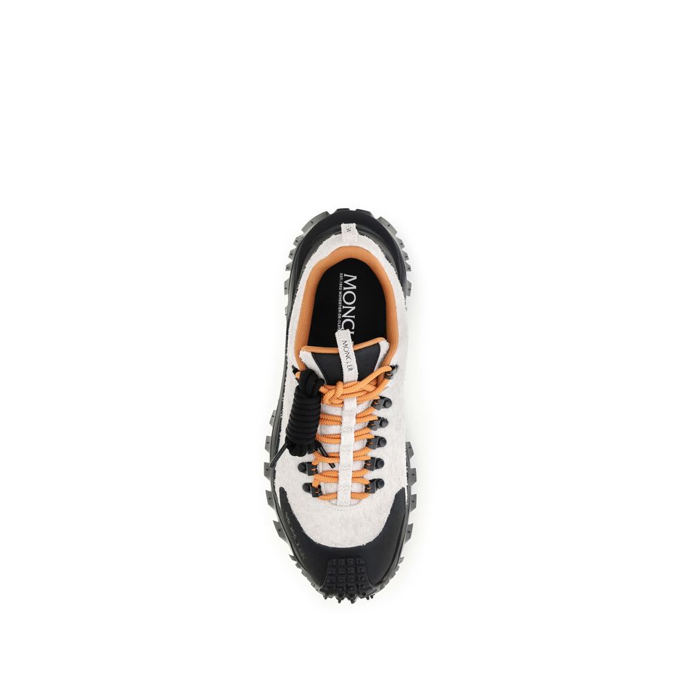 Athletic Sneakers by Moncler for men in eva tu & bos taurus suede calf leather multicolor showcases an impeccable silhouette, defined by an impeccable athletic style design that perfectly captures the essence of the Men's Athletic EVA TU & Bos Taurus Suede Calf Leather Sneakers.