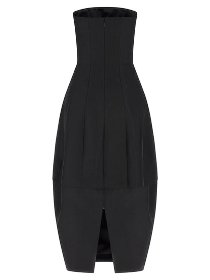 Dress by Khaite for women in wool & silk black features a dramatic silhouette, showcasing an elegant and that flows into a dramatic long.