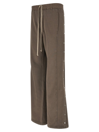 Trousers by DRKSHDW for men in cotton gray presents a smart silhouette, meticulously detailed with a smart flared & wide, a smart long, and a smart .