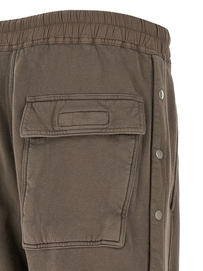 Trousers by DRKSHDW for men in cotton gray presents a perennial silhouette, meticulously tailored with a flared & wide cut, long finish, and an elegant .