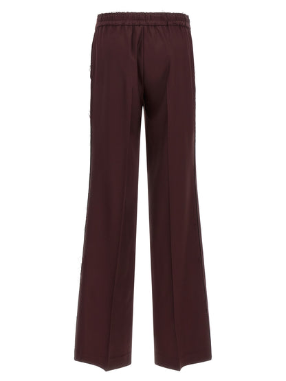 Trousers by Gianluca Capannolo for women in polyester purple presents a perennial silhouette, meticulously tailored with a wide cut, long finish, and an elegant .