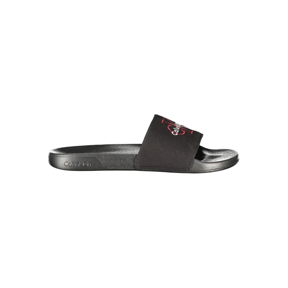 Slider Sandals by Calvin Klein for men in polyester polyurethane cotton black features an architectural design from the Men's Polyester Polyurethane Cotton Slider Sandals collection, defined by a architectural and for a architectural finish.