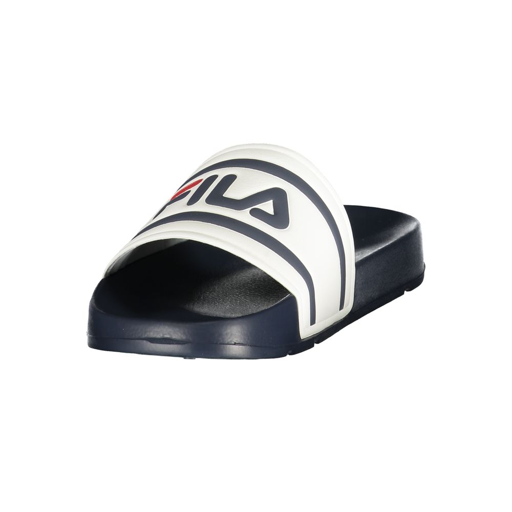 Slippers by Fila for men in polyurethane and blue & white presents a sculptural silhouette as Crisp Men's Polyurethane Slippers, featuring a sculptural and a sculptural for refined comfort.