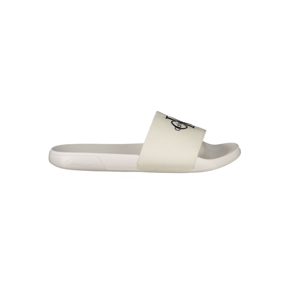 Sandals by Calvin Klein for women in polyester & polyurethane and black & white presents a sculptural silhouette, showcasing the signature style of the Women's Polyester & Polyurethane Sandals with a sculptural and sculptural .