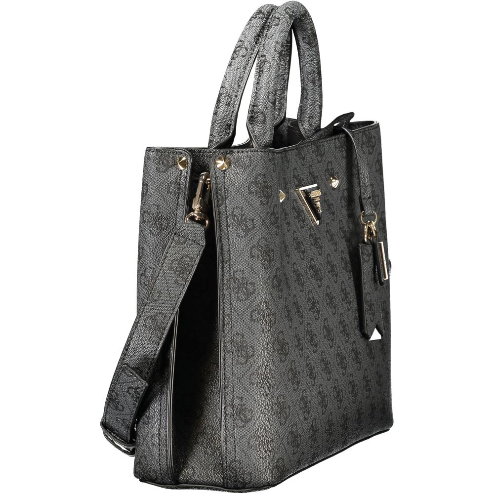 Handbag by Guess Jeans for women in polyurethane black, signature-print & print features a signature silhouette, showcasing a secure snap & zipper and signature document-holder, external-pockets & internal-pockets with versatile shoulder-strap, adjustable-strap & handle for a sophisticated look.