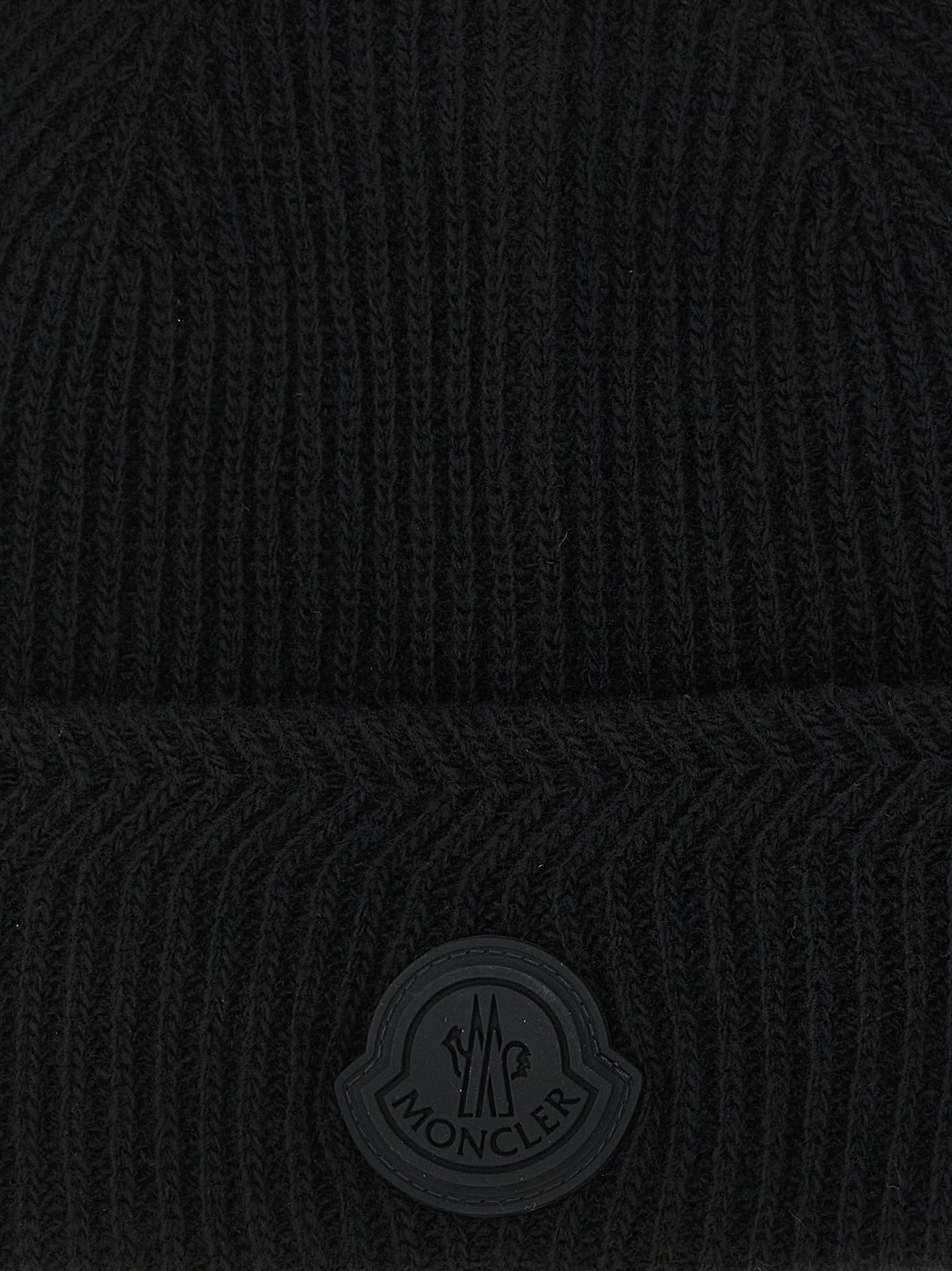 Beanie Hat by Moncler for men in cashmere virgin wool black, patterned & herringbone presents a sleek silhouette, showcasing the sleek texture and refined craftsmanship of the Cashmere Virgin Wool Beanie Hat collection.