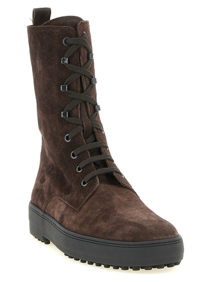 Lace-Up Ankle Winter Boots by Tod's for women in calfskin leather brown features an high-performance silhouette, showcasing the sophisticated design of the Women's Calfskin Leather Lace-Up Ankle Winter Boots with a and a refined .
