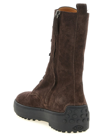 Lace-Up Ankle Winter Boots by Tod's for women in calfskin leather brown features an effortless chic silhouette from the Women's Calfskin Leather Lace-Up Ankle Winter Boots collection, showcasing a effortless chic and refined for an effortless chic look.