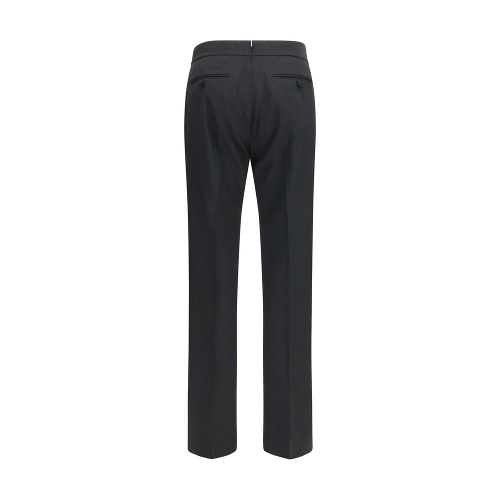 Trousers by Tom Ford for men in wool black features a tailored silhouette with a tailored straight-leg & regular-fit, defined by its long and a sophisticated .