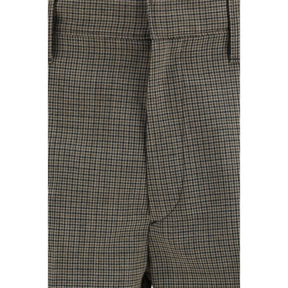 Trousers by Prada for men in wool brown, patterned & checked presents a perennial silhouette, meticulously tailored with a regular-fit & slim cut, long finish, and an elegant .