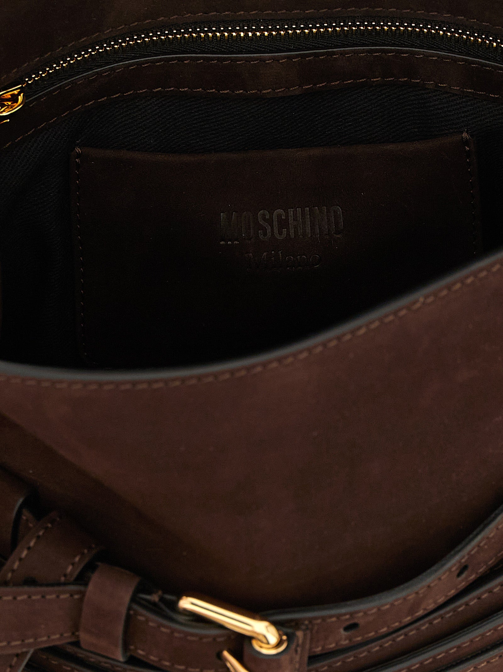 Small Shoulder Flap Handbag by Moschino for women in nubuck calfskin leather brown & gold features a contemporary silhouette, showcasing a secure flap & buckle, ample , and contemporary handle, adjustable-strap & belt-strap for a sophisticated look.