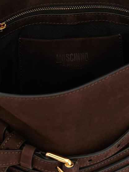 Small Shoulder Flap Handbag by Moschino for women in nubuck calfskin leather brown & gold features a contemporary silhouette, showcasing a secure flap & buckle, ample , and contemporary handle, adjustable-strap & belt-strap for a sophisticated look.