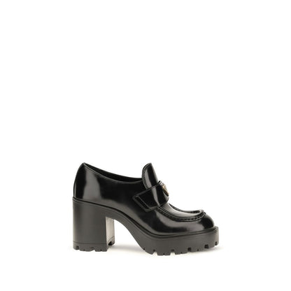 Platform Loafer Shoes by Prada for women in bos taurus calf leather black showcases a impeccable silhouette as Women's Bos Taurus Calf Leather Platform Loafer Shoes, artfully designed with a impeccable platform and refined for a impeccable finish.