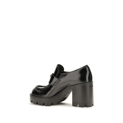 Platform Loafer Shoes by Prada for women in bos taurus calf leather black showcases a resplendent Women's Bos Taurus Calf Leather Platform Loafer Shoes aesthetic, defined by its resplendent and elegant platform.