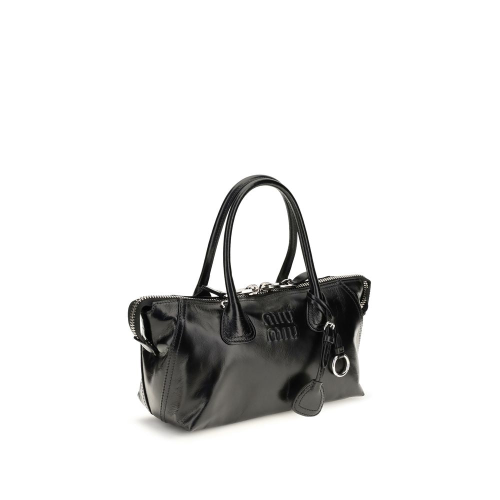 This Handbag by Miu Miu for women in bos taurus calf leather and black presents a sculptural silhouette featuring a secure , ample , and versatile for a sculptural finish.