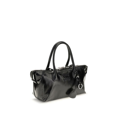 This Handbag by Miu Miu for women in bos taurus calf leather and black presents a sculptural silhouette featuring a secure , ample , and versatile for a sculptural finish.