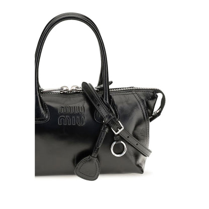 Handbag by Miu Miu for women in bos taurus calf leather black features a contemporary silhouette, showcasing a secure , ample , and contemporary for a sophisticated look.