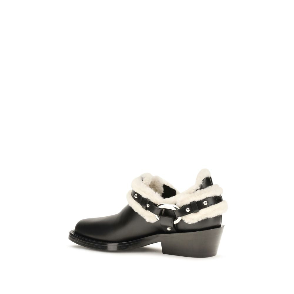 Ankle Biker Boots by Rabanne for women in bos taurus calf leather black showcases a impeccable silhouette as Women's Bos Taurus Calf Leather Ankle Biker Boots, artfully defined by a impeccable and a impeccable .