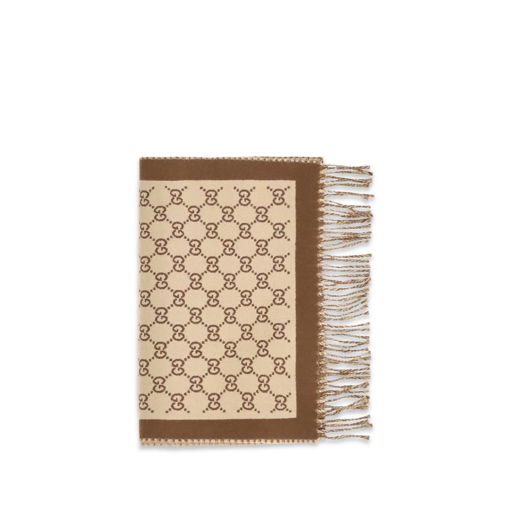 Scarf by Gucci for women in merino wool beige features a timeless silhouette, artfully capturing the essence of the timeless Gg Merino Wool Fringes Scarf design for a sophisticated look.