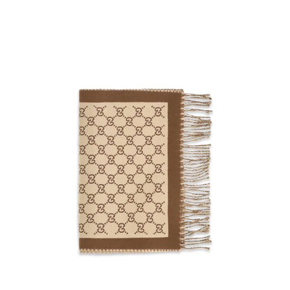 Scarf by Gucci for women in merino wool beige features a timeless silhouette, artfully capturing the essence of the timeless Gg Merino Wool Fringes Scarf design for a sophisticated look.