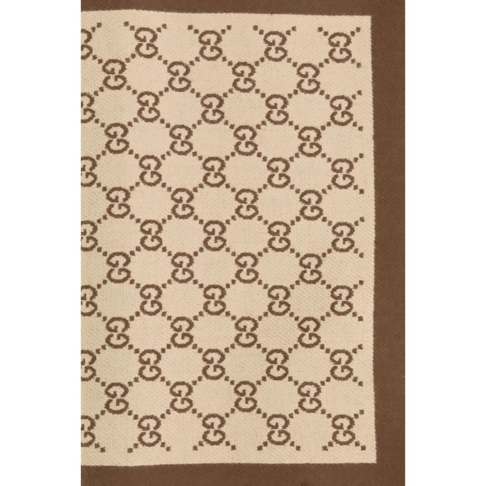 Scarf by Gucci for women in merino wool beige features a snug silhouette, perfectly showcasing the elegant drape and premium finish of the Gg Merino Wool Fringes Scarf.