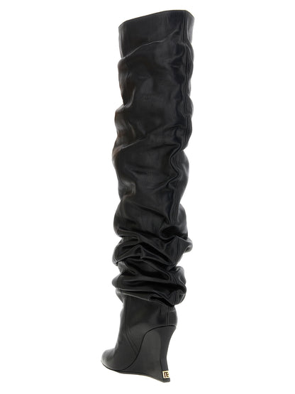 Wedge Over-The-Knee Boots by Balmain for women in calfskin leather black & signature features an enchanting design from the Women's Calfskin Leather Wedge Over-The-Knee Boots collection, highlighting a enchanting wedge and pointed toe style for a refined look.
