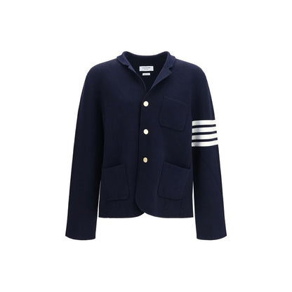 Overcoat by Thom Browne for men in polyamide & wool blue, signature & striped presents a luxurious silhouette, showcasing a luxurious and sophisticated pockets for a premium, luxurious look.
