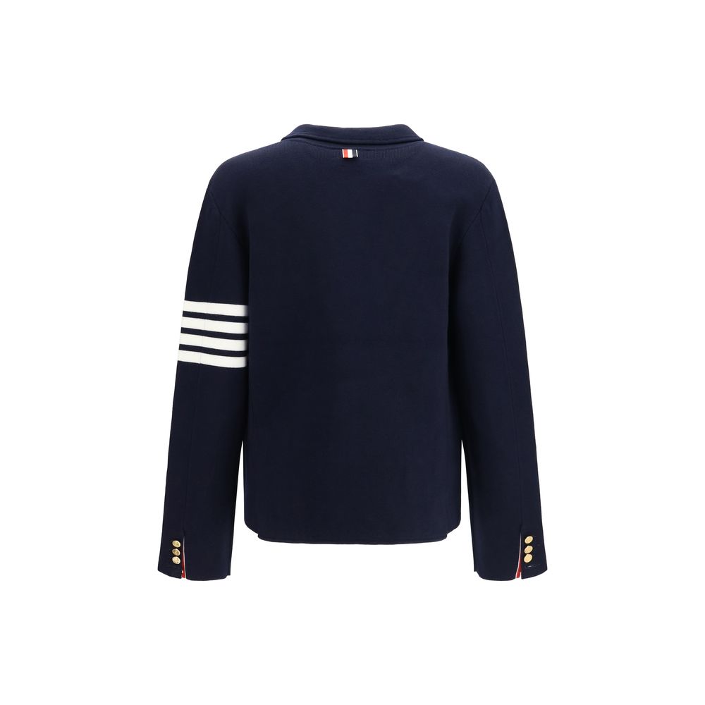 Overcoat by Thom Browne for men in polyamide & wool blue, signature & striped showcases a enveloping silhouette, detailed with distinctive pockets and a enveloping .