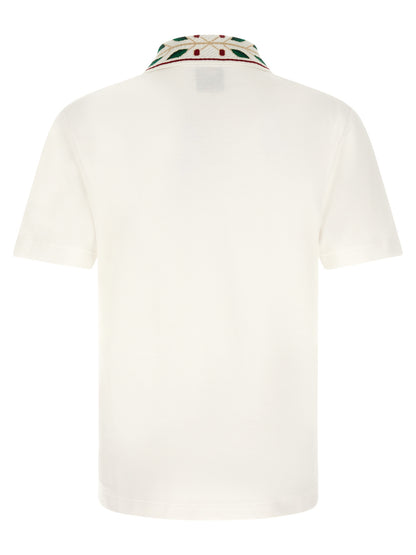 This Polo Shirt by Casablanca for men in organic cotton white & patterned presents a flawless silhouette, showcasing flawless detailing and a refined for a truly flawless aesthetic.