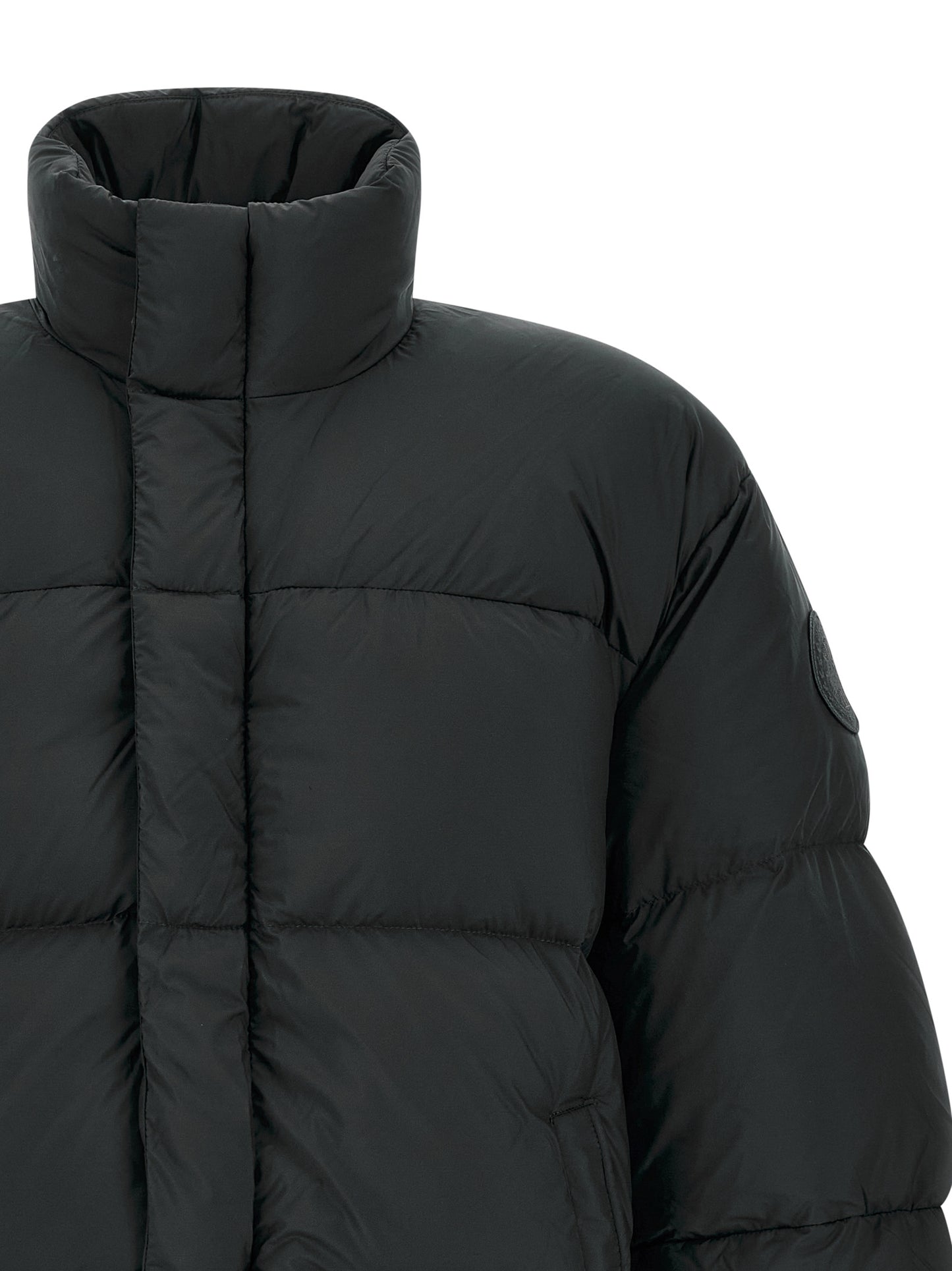 Puffer Jacket by Canada Goose for men in polyamide black features a dramatic silhouette, showcasing a sophisticated high-neck neckline and distinctive insulated for a dramatic aesthetic.