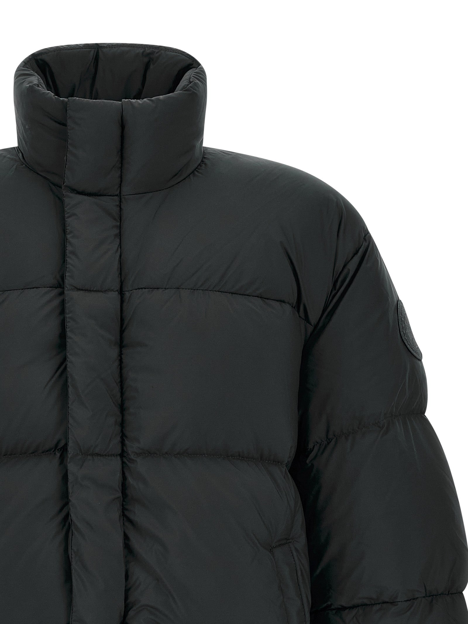 Puffer Jacket by Canada Goose for men in polyamide black features a dramatic silhouette, showcasing a sophisticated high-neck neckline and distinctive insulated for a dramatic aesthetic.