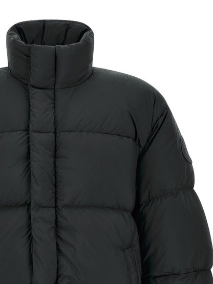 Puffer Jacket by Canada Goose for men in polyamide black features a dramatic silhouette, showcasing a sophisticated high-neck neckline and distinctive insulated for a dramatic aesthetic.
