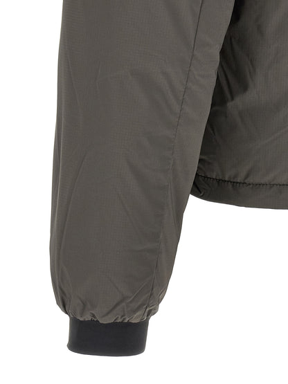Overcoat by Canada Goose for men in polyamide bicolour, green & olive features an satoral silhouette, showcasing a sophisticated and satoral thermal, pockets & insulated for a premium, timeless look.