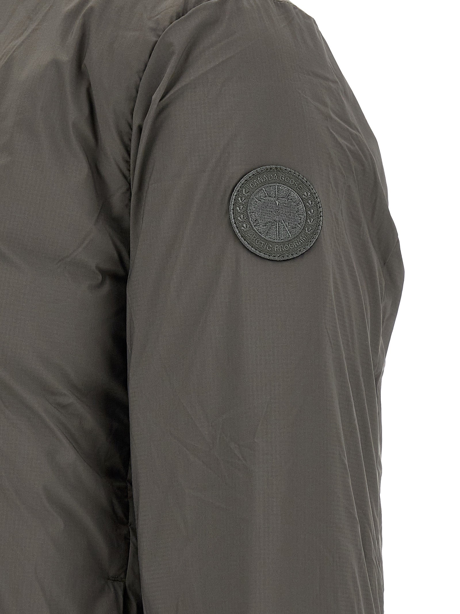 Overcoat by Canada Goose for men in polyamide bicolour, green & olive presents a luxurious silhouette, showcasing a luxurious and sophisticated thermal, pockets & insulated for a premium, luxurious look.